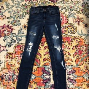 Distressed dark wash jeans